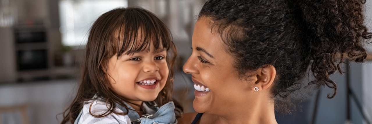 5 Things Parents of Kids With Autism Want You to Know Mother holding her toddler daughter.