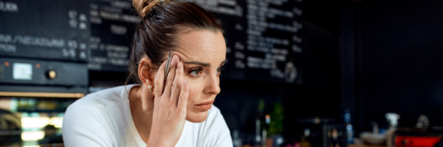Frustrated woman at a cafe