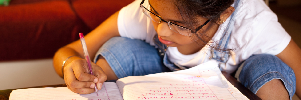 The Link Between ADHD and Dyscalculia Child doing math homework.