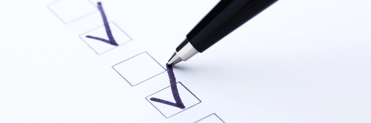 4 Things to Do If You Were Just Diagnosed With a Chronic Illness Pen checking boxes on white paper.