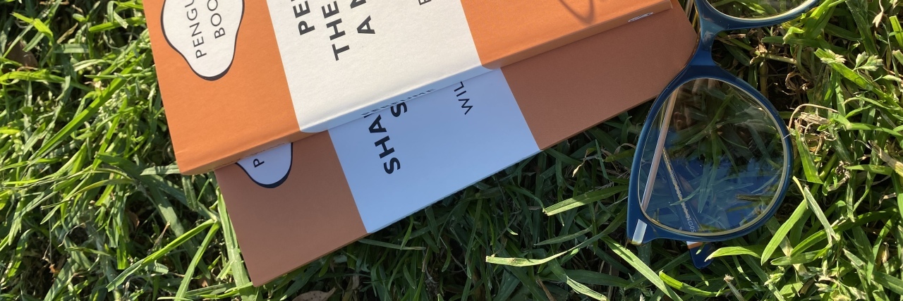 5 Study Tips for College Students With a Chronic Illness or Disability Textbook outdoors on the grass.