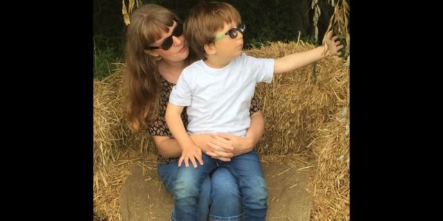 The Change in Social Circles While Parenting a Child With a Disability a mother sitting with her son with a disability on her lap