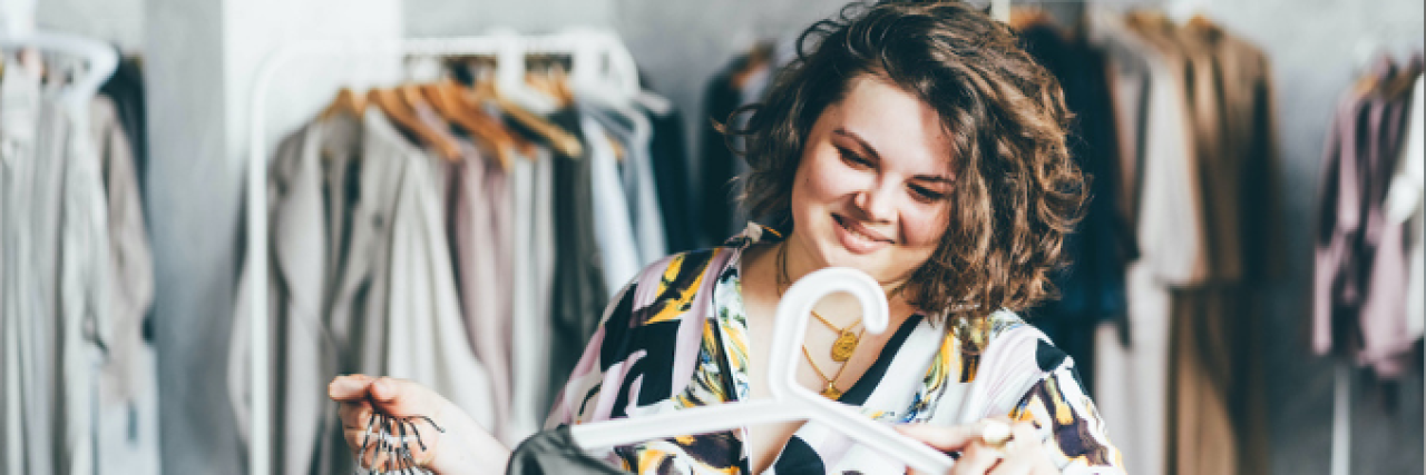 Buying New Clothes and Accepting My Body in Eating Disorder Recovery Woman looking at clothing in store