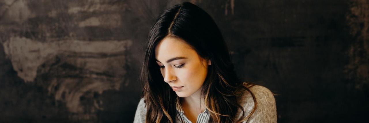 Harmful 'Compliments' When You Have an Eating Disorder Woman in professional setting holding portfolio