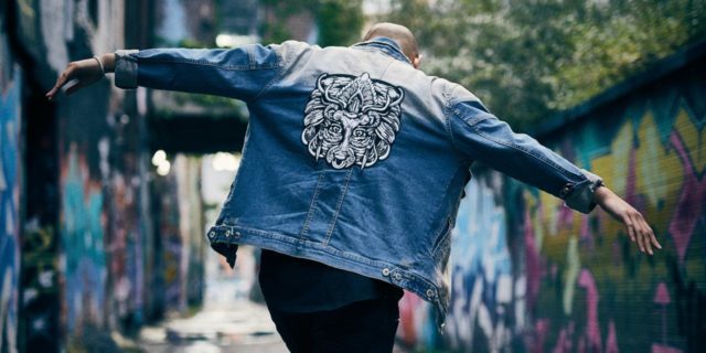 How ‘Radical Acceptance’ Builds a Bridge Between the Gulfs of Who I Am photo of a man walking down an alley with his arms outstretched and head lowered