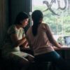 photo of a mother and daughter talking in a coffee shop
