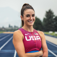 Dani Aravich wearing her Team USA uniform at a running track.