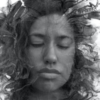 black and white abstract paintography portrait of woman with curly hair and closed eyes