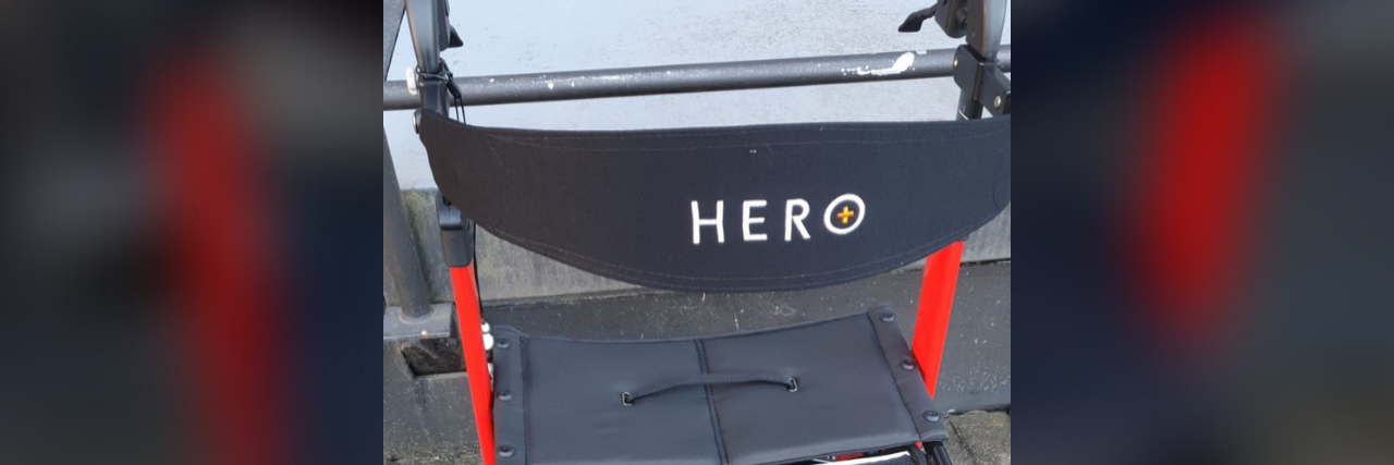 Battling Internalized Ableism as Someone With Chronic Illness Red rollator walker.