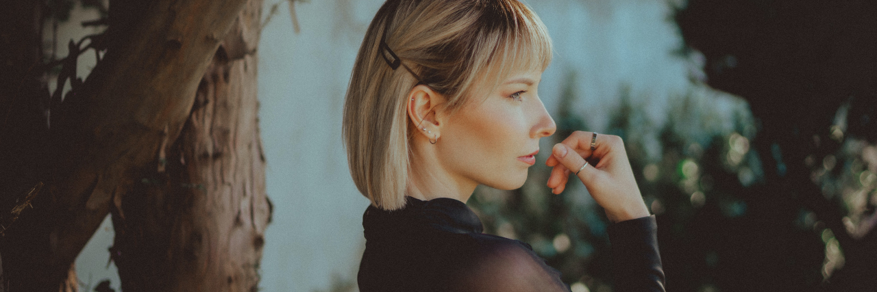 I Was Flashed by a Stranger and Now I Feel Unsafe photo of a woman looking angry and off camera