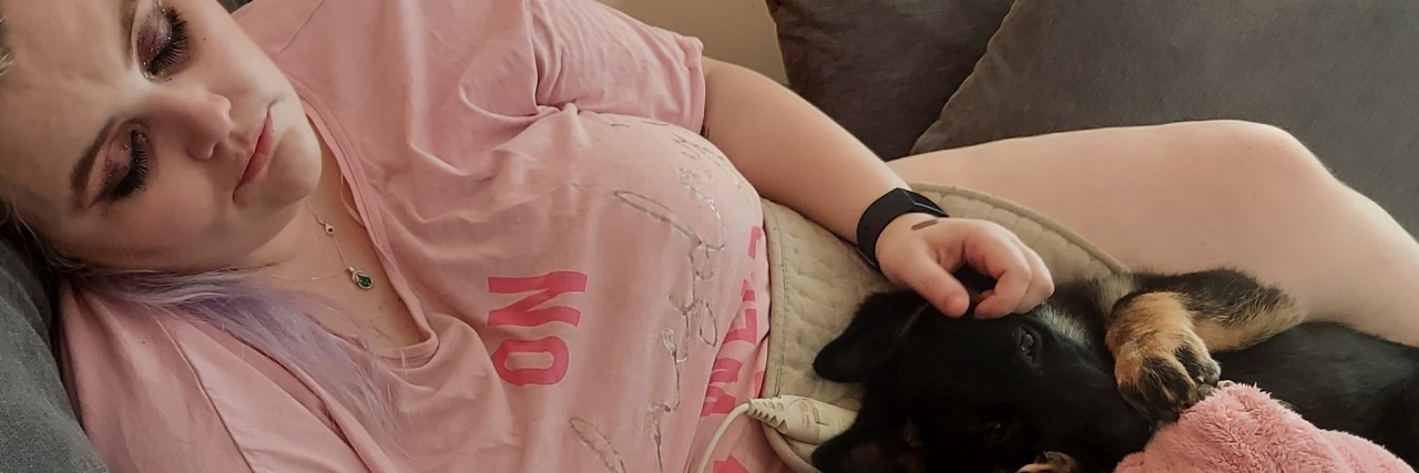 5 Sneaky Symptoms of Chronic Illness I Thought Were 'Normal' Snuggled with my puppy mid flare-up.
