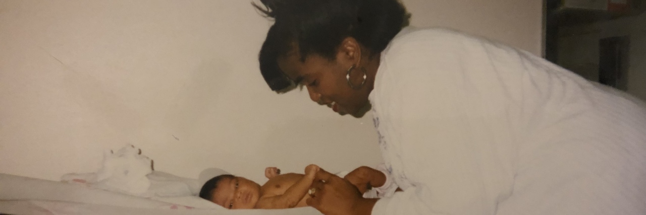Raising Strong Daughters: A Letter to Girl Moms Black mother smiling at infant daughter