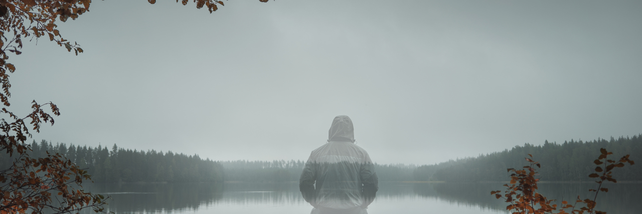 The Invisibility Cloak I Wear as a Disabled Person Transparent person sitting on a bench.