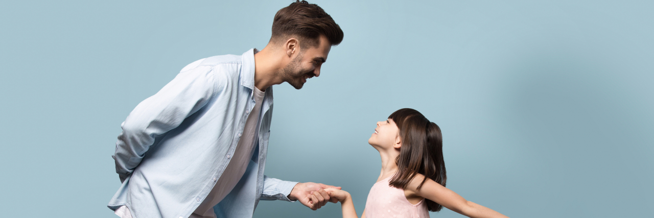 Reparenting Requires More 'Nontraditional' Father Types in the Media Father in a nice shirt and jeans dancing with his daughter in a pink dress