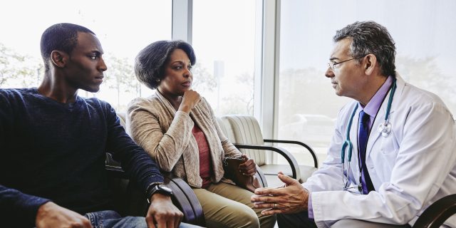 I Should Not Need a Man With Me to Be Taken Seriously at Medical Appointments man and woman talking to doctor.