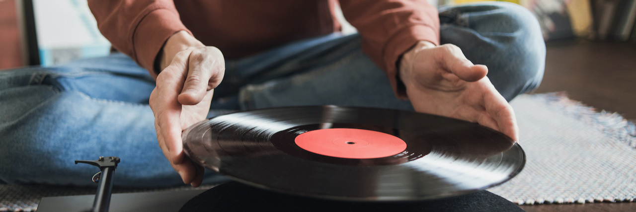 How Nostalgia Is Helping Me Cope With Grief man with a record