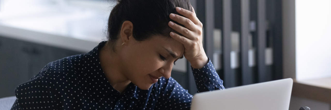 Stressed person at work.