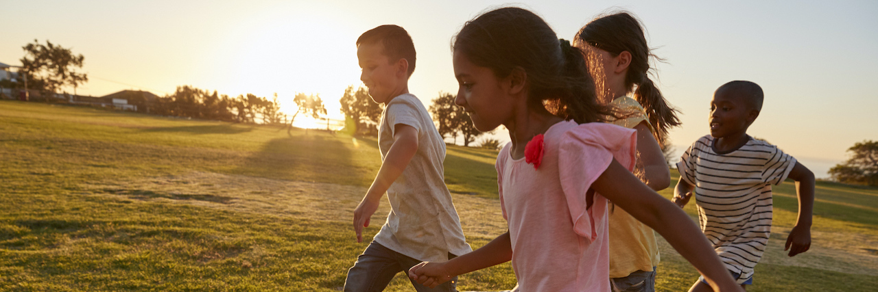 The Reality of Young Children and Suicide Four children running barefoot in a park