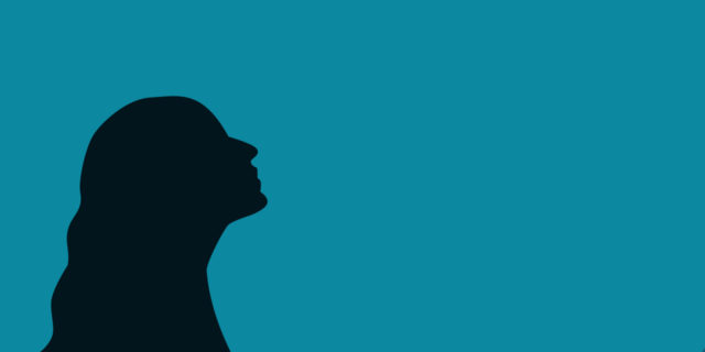 Silhouette of woman looking up.