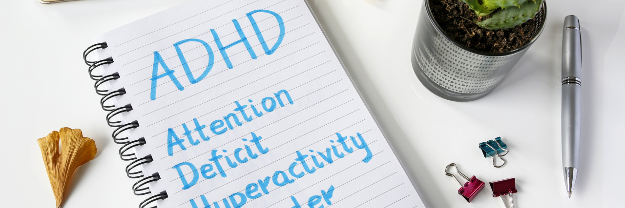 AskMe: We Asked an Expert All of Your Questions About ADHD ADHD Attention Deficit Hyperactivity Disorder written in notebook on table.