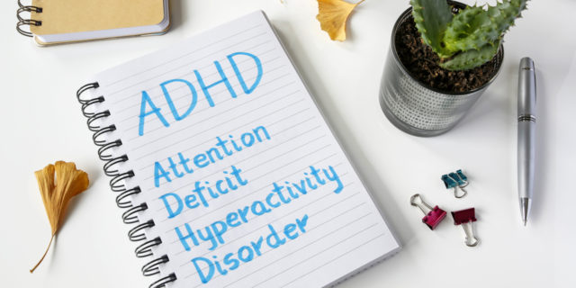 AskMe: We Asked an Expert All of Your Questions About ADHD ADHD Attention Deficit Hyperactivity Disorder written in notebook on table.