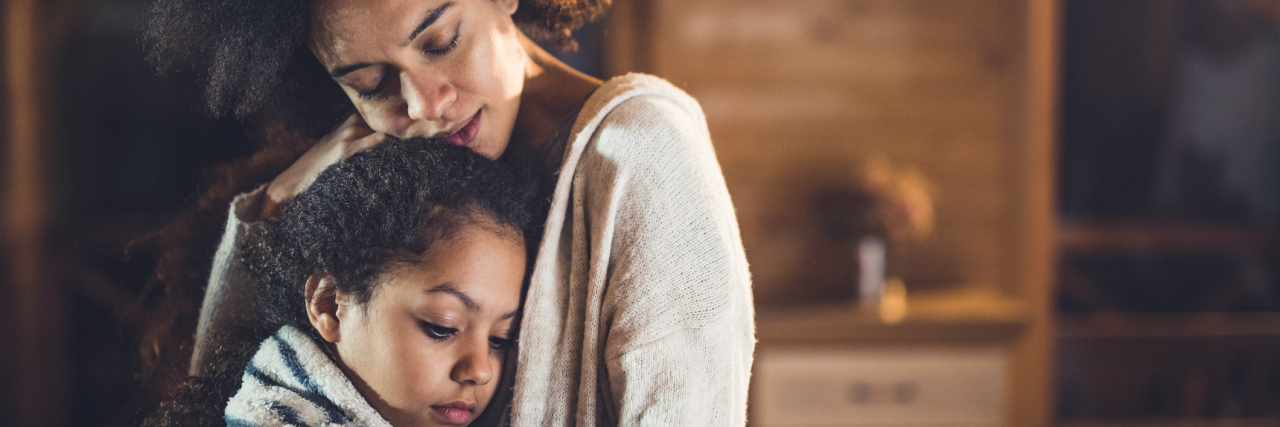 Parenting With a Serious Mental Illness: What Clinicians Need to Learn Black mother hugging her young daughter, comforting her