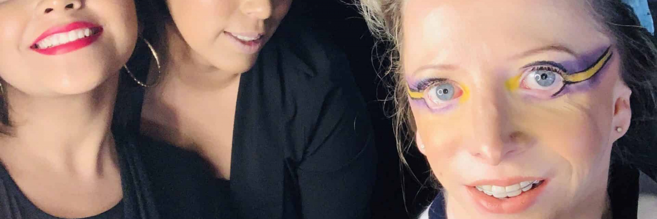 Realizing My Biggest Dreams as a Disabled Craniofacial Model Contributor with hair and makeup done and posing with others at fashion show