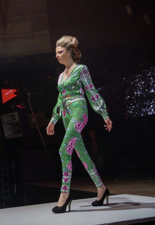 Cynthia walking on the runway for a fashion show