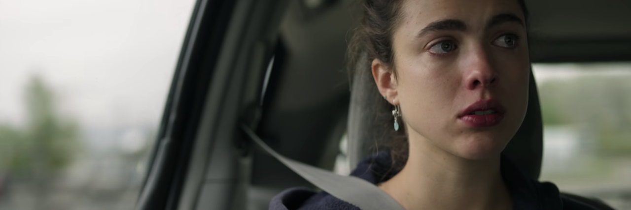 screenshot from the Netflix show Maid, showing the main character looking upset in a car