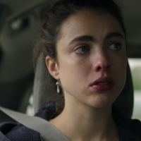 screenshot from the Netflix show Maid, showing the main character looking upset in a car