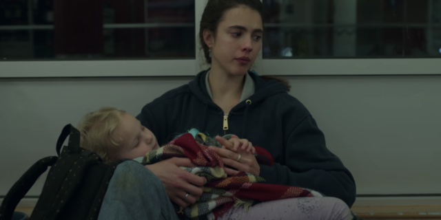 screenshot from Netflix series Maid, showing the main character crying and holding her young child