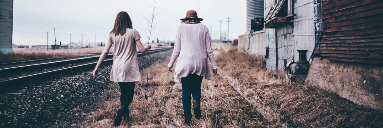 An Apology for When My Social Anxiety Hurts My Friends Back of two women walking outside in the fall