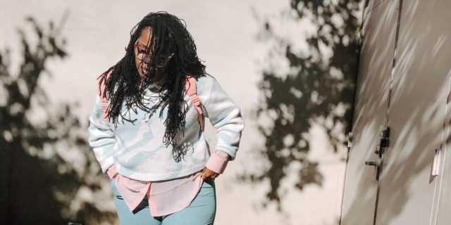 The Struggle of Seeing Therapists Who Have Privilege In Areas I’ve Been Oppressed photo of a woman standing in street with hands in pockets