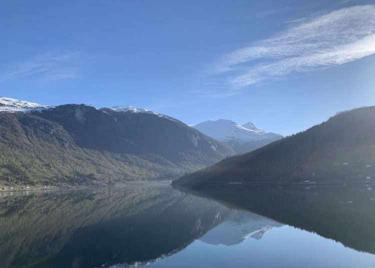 Tranquil lake surrounded by mountains