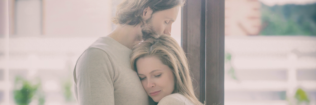 To My Husband, Whom I’ve Hurt Because of Being in Chronic Pain Sad young married couple embracing.
