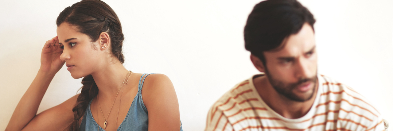 How Loss and Illness Changes a Marriage Shot of a young couple having an argument while sitting on their couch at home