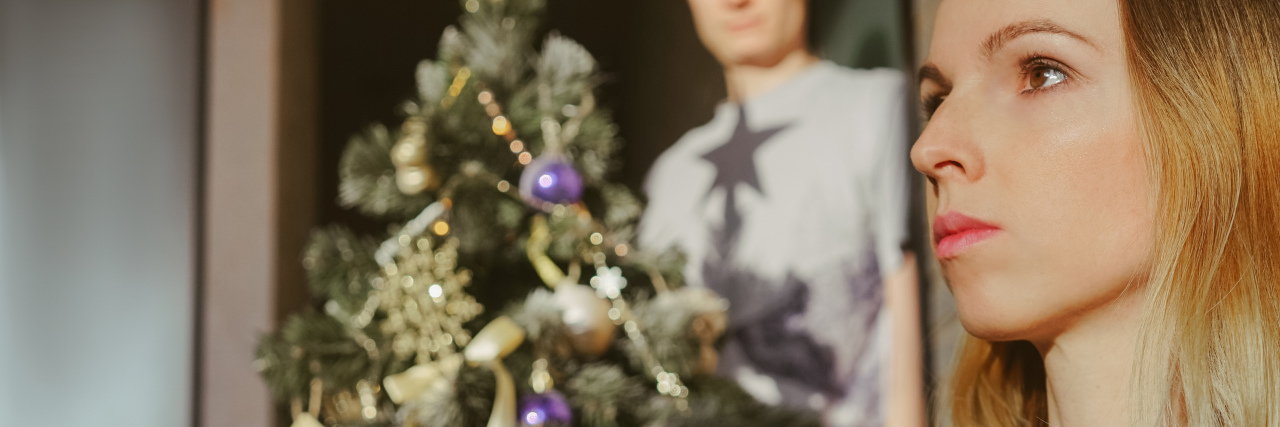 When Relatives Judge Your Health Conditions at Holiday Gatherings Unhappy woman at Christmas.