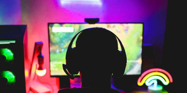 Why I Love Streaming (Despite the Challenges) as Someone With Chronic Illness Streamer gamer playing a strategy game in broadcast.