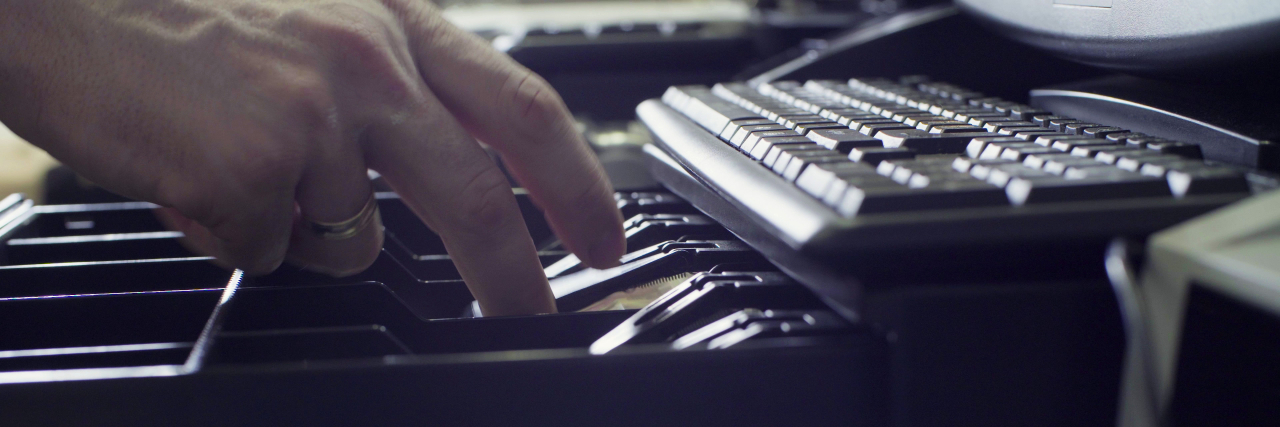 The Challenge of Starting a New Job With Learning Disabilities Person's hands putting money in cash register.