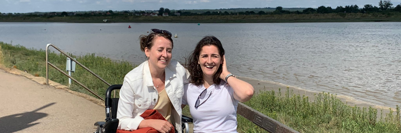 A Love Letter to My Wheelchair Simone in wheelchair by the water.