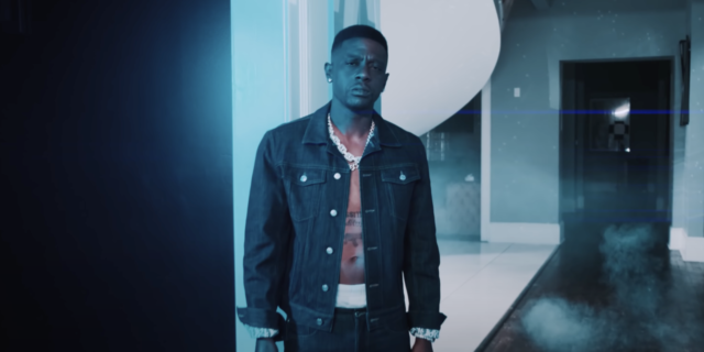 screenshot from Boosie Badazz's video for Hell's Angel, showing the rapper looking into the camera with a serious expression