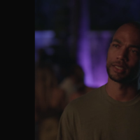 Nathan, a bald Black man in a sweater, from the show "Insecure" with a sad experession