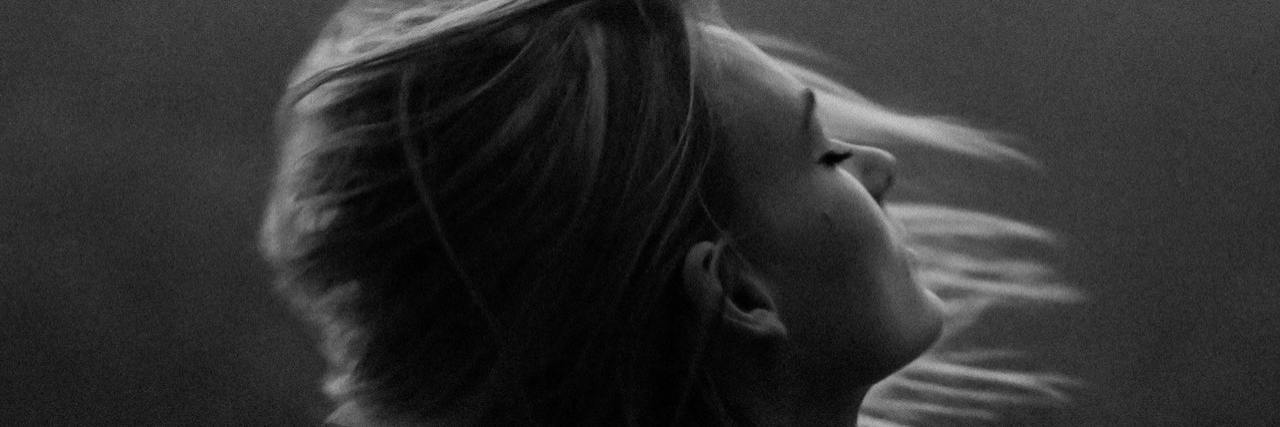 My Eating Disorder Behaviors, Control and Coping With Psychosis Black and white photo of profile of woman with wind blowing her hair