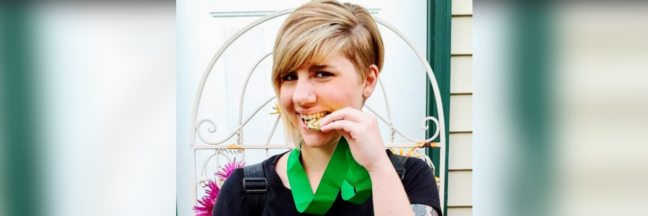 Using My Platform as an Author to Spread Gastroparesis Awareness Kristiana wearing a gastroparesis awareness t-shirt.