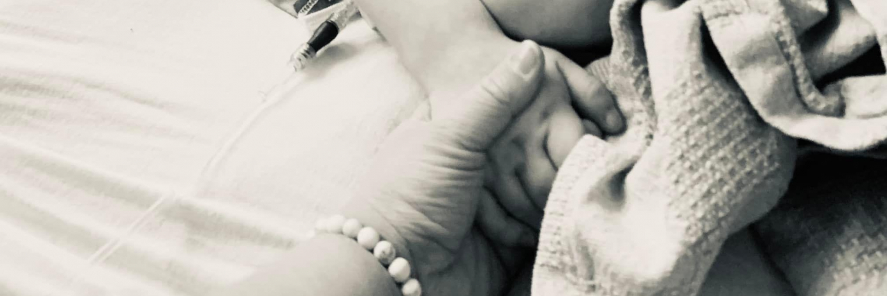 Supporting My Child With a Rare Disease, Hunter Syndrome Rebecca holding her son.