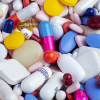 Frame of photo filled with pile of pills in different colors and shapes