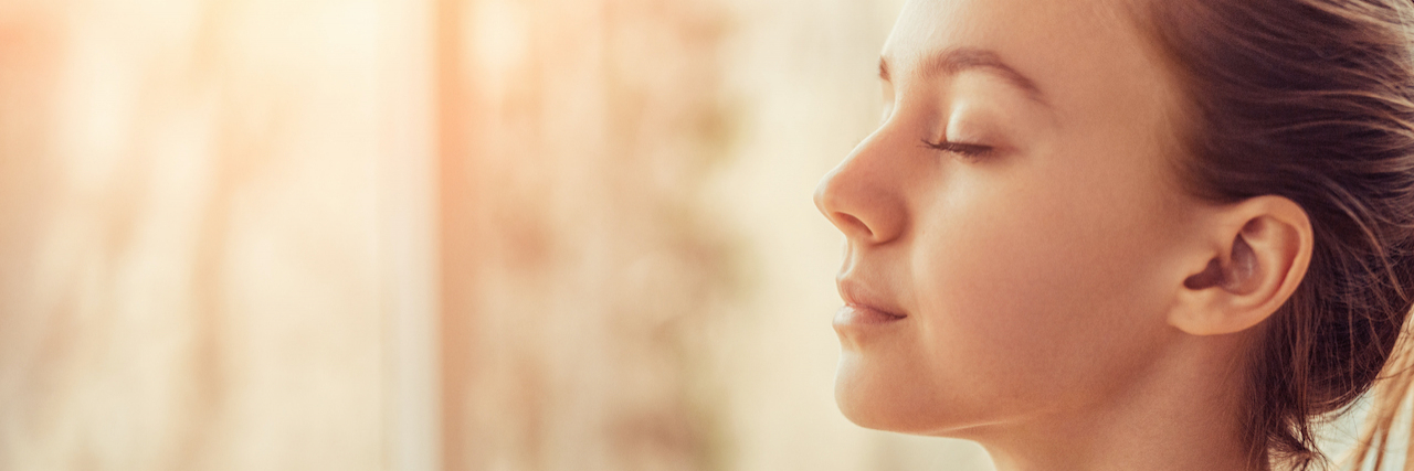 Understanding Intent With Self-Harm and Self-Mutilation Behaviors Side view of woman with eyes closed and peaceful expression