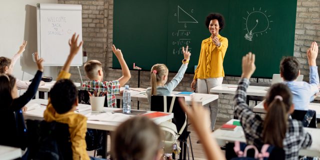 How We Can Make Disability Accommodations in Schools More Equitable Teacher in class full of students.