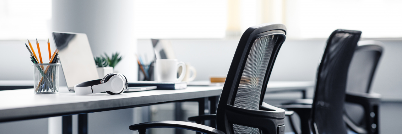 How Ableist Workplace Policies Harm Employees With Chronic Illnesses Empty office.