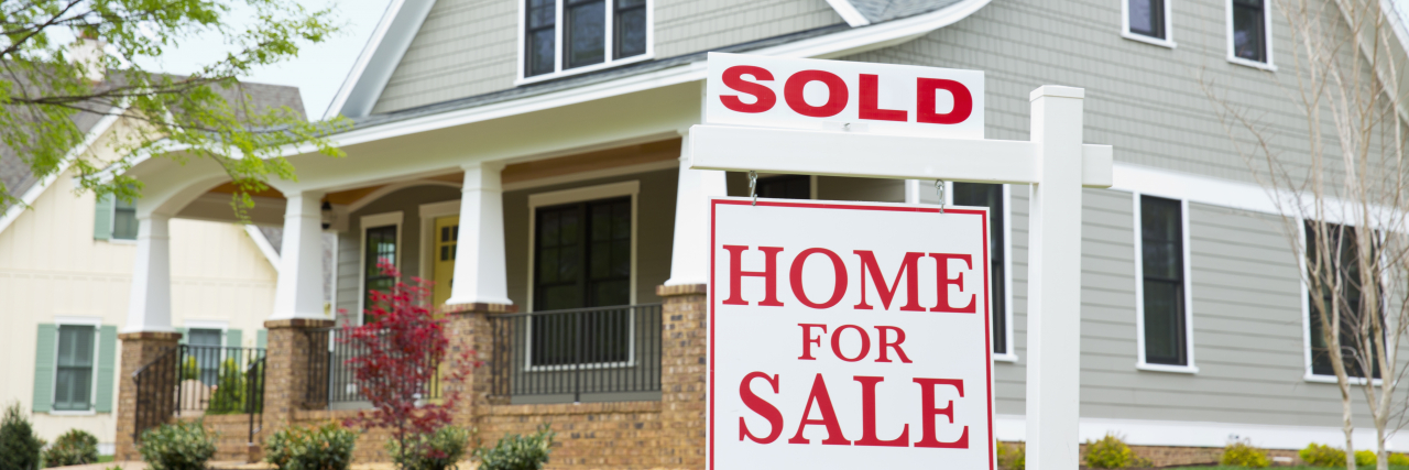 How Homeownership Has Given Me Independence With Learning Disabilities House with "sold" sign in front yard.